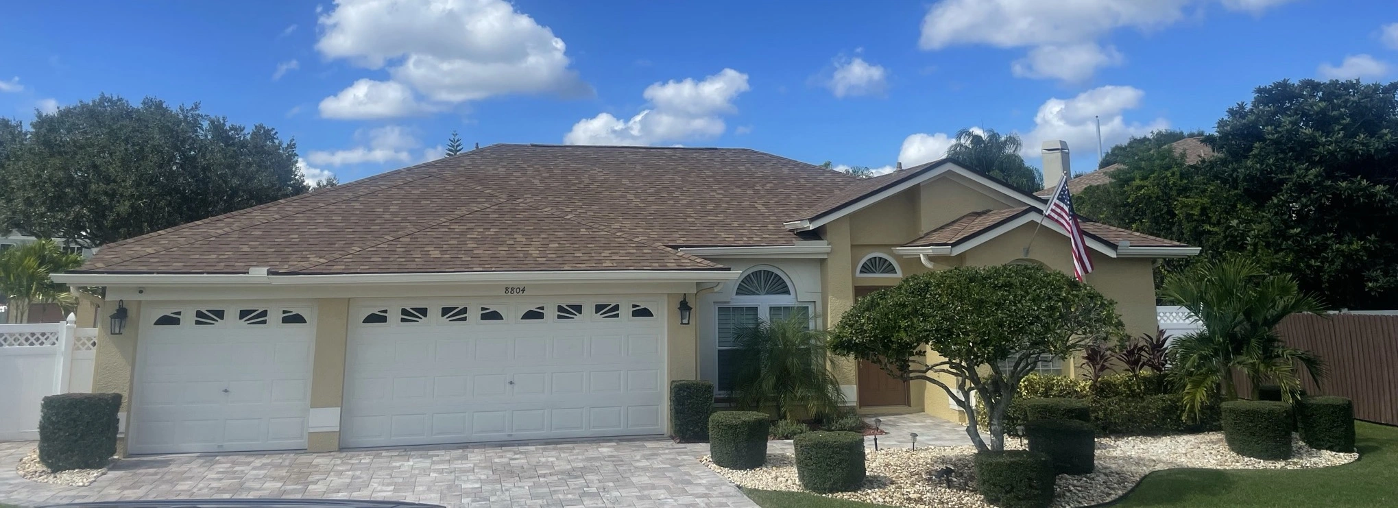 House with a new roof done by Trust Roofing on a sunny Tampa Bay day